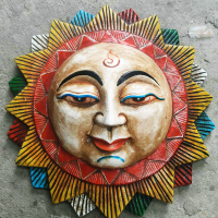 Wood carved mask of the Sun